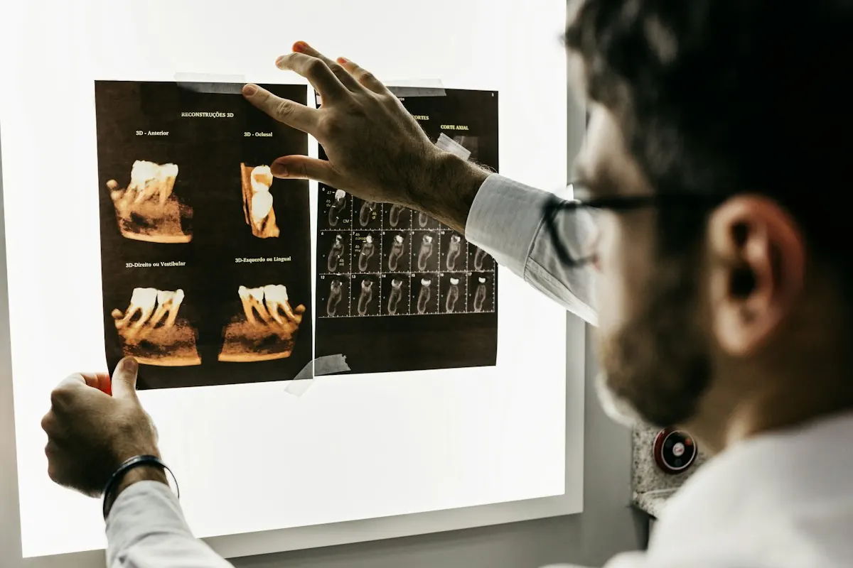 Dentist studying dental X-rays on a light box